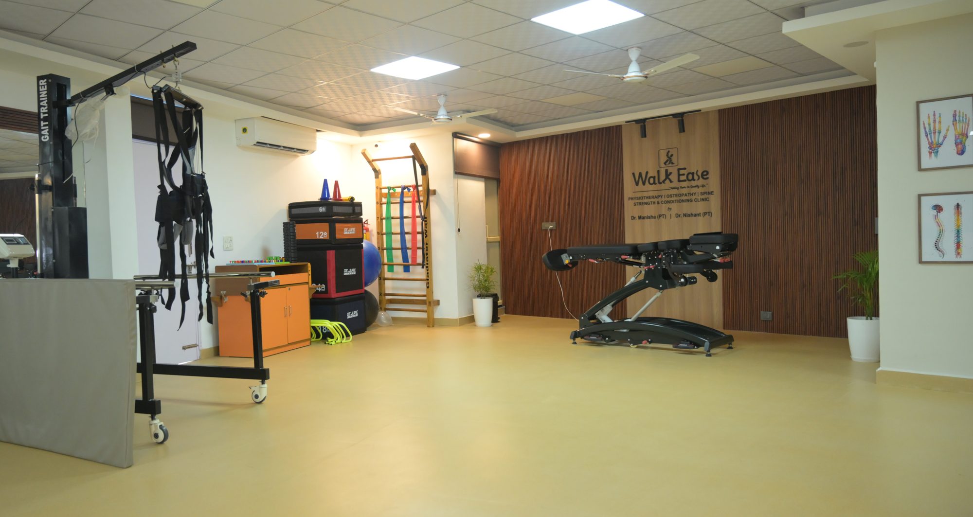 Rehab floor at Walk Ease Physiotherapy Clinic, Sector 37 Faridabad, with gait trainer, wall bars and traction table